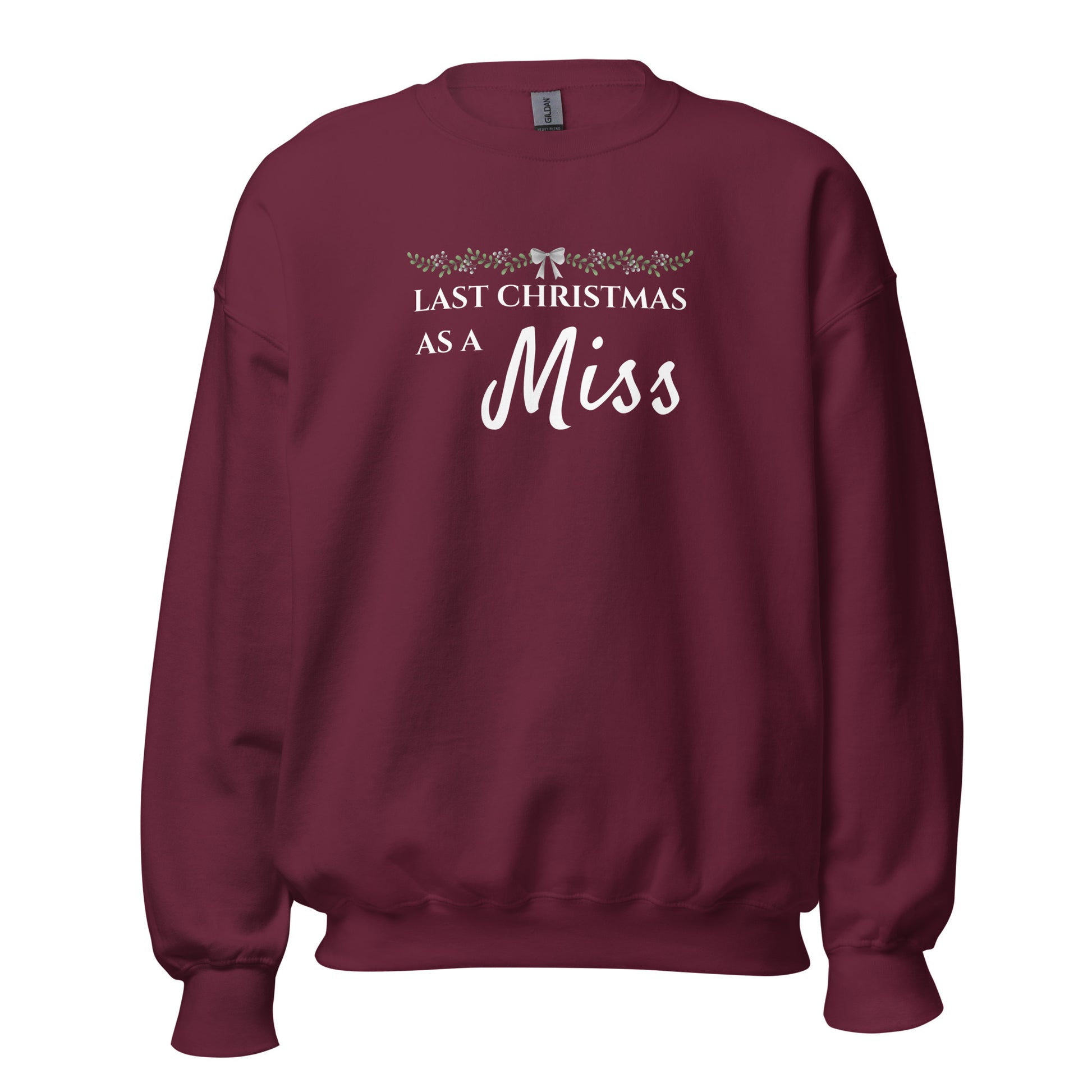 Maroon bridal Christmas jumper with “Last Christmas As A Miss” slogan and festive bow design – perfect for Irish winter brides-to-be.